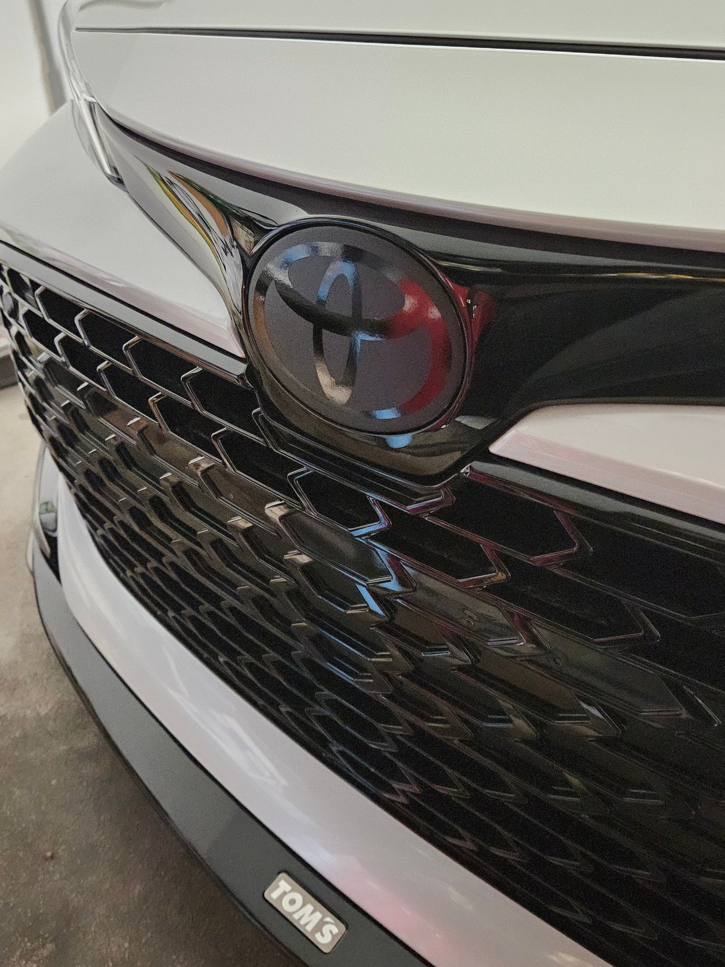 2019 - 2025 Toyota Corolla Hatchback Stealth Front Emblem Vinyl Overlay