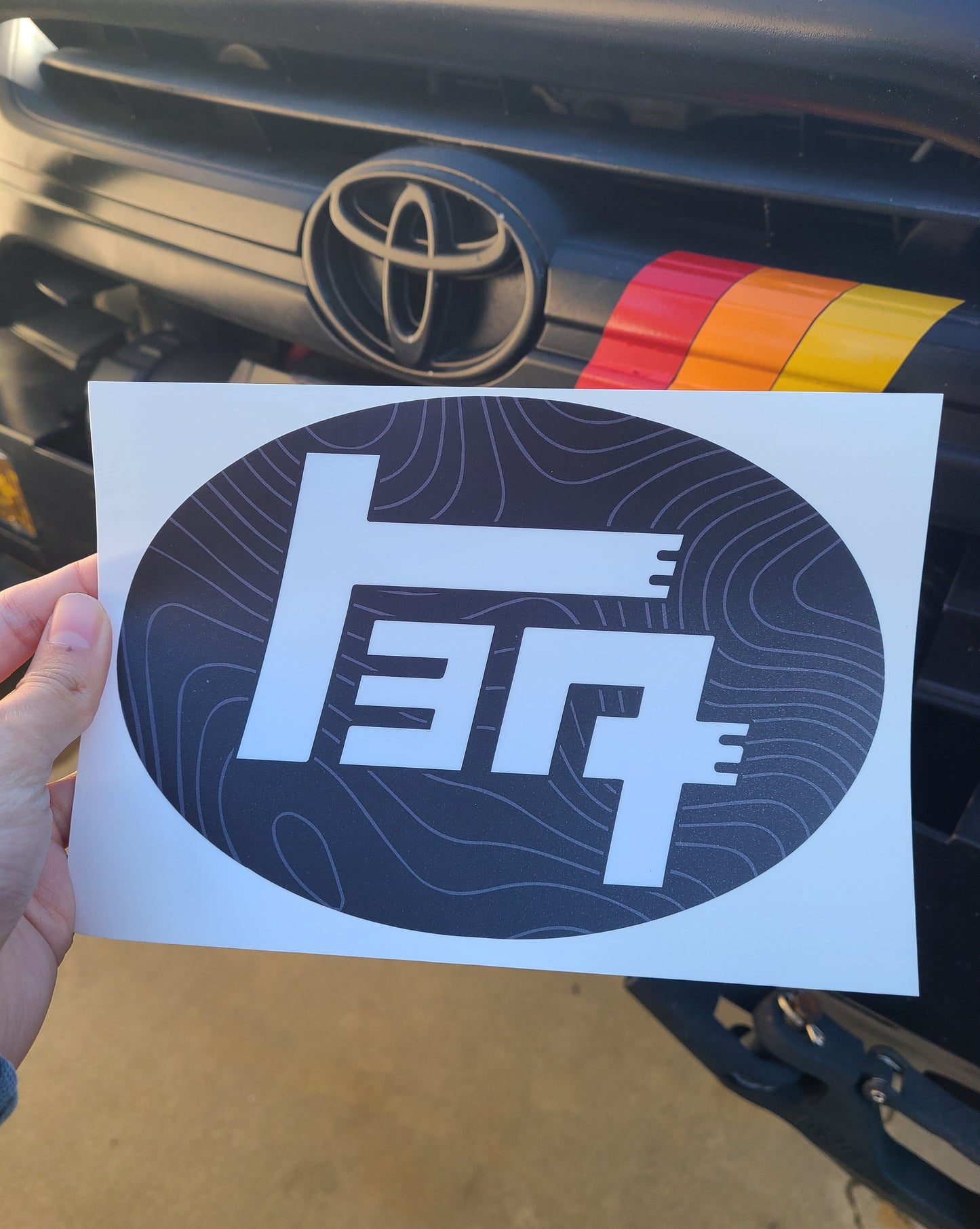 2018-2023 Toyota Tacoma Topographic Front Emblem Vinyl Overlay - "TEQ" Logo