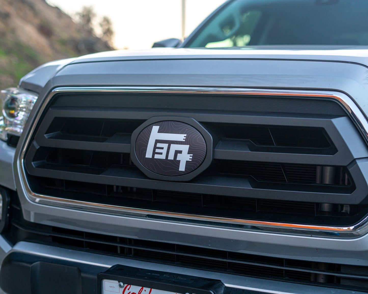 2018-2023 Toyota Tacoma Topographic Front Emblem Vinyl Overlay - "TEQ" Logo