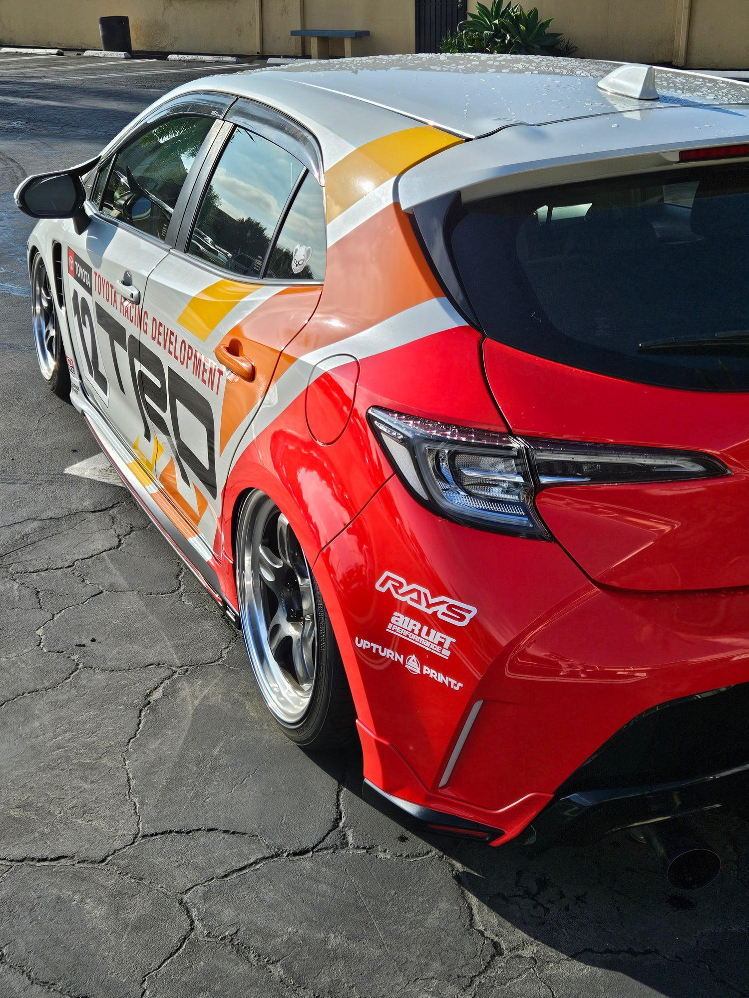 custom livery printed and installed for a corolla hatchback featuring heritage stripes